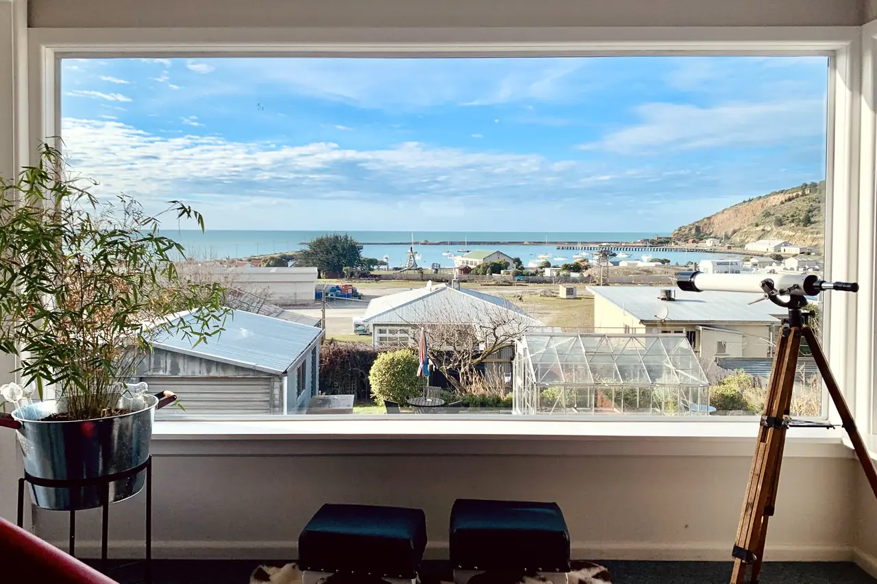 Living room window looking over a coastal town